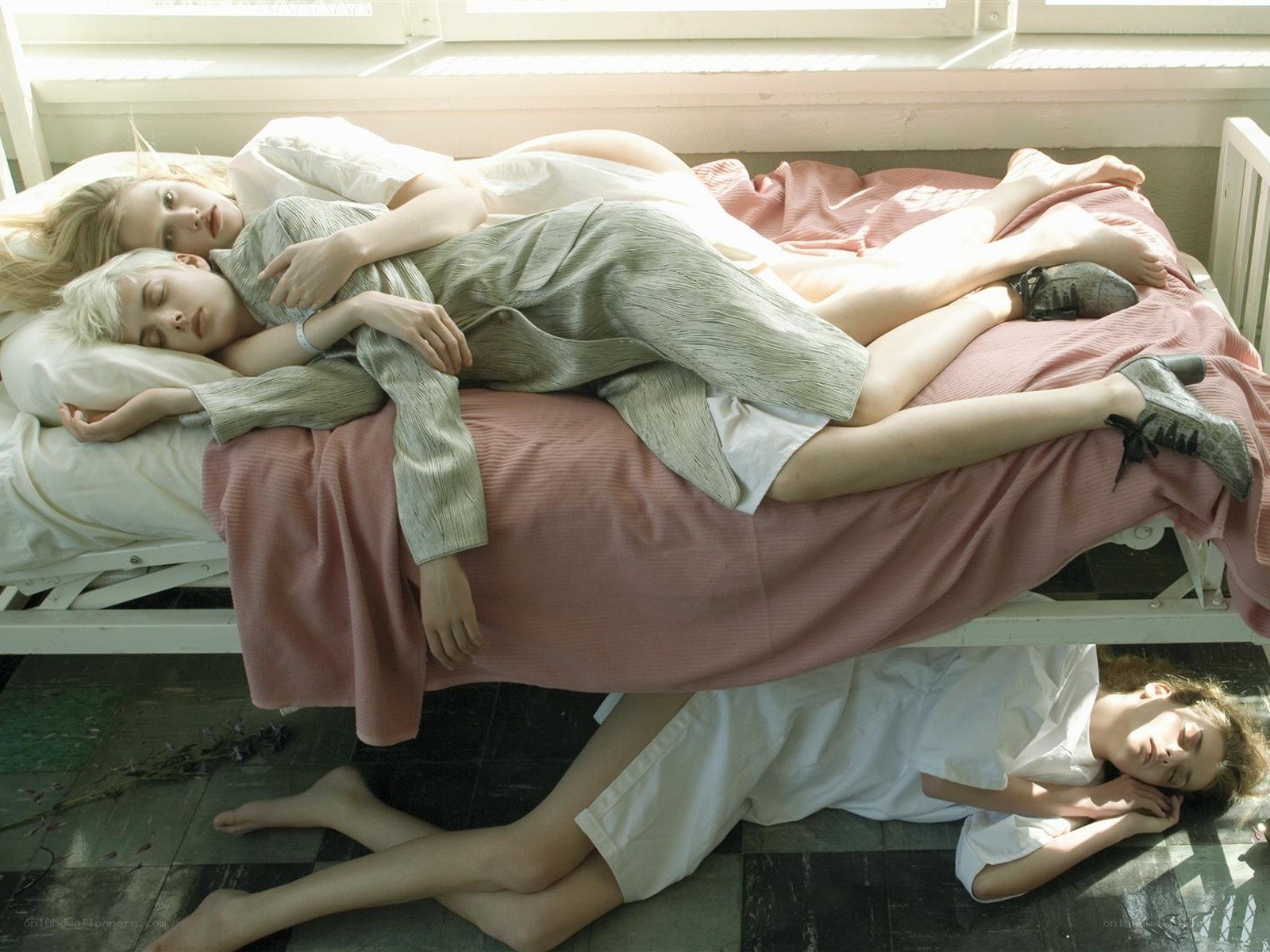 People sleeping on a bed