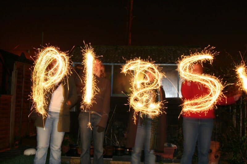People spelling PIES with sparklers