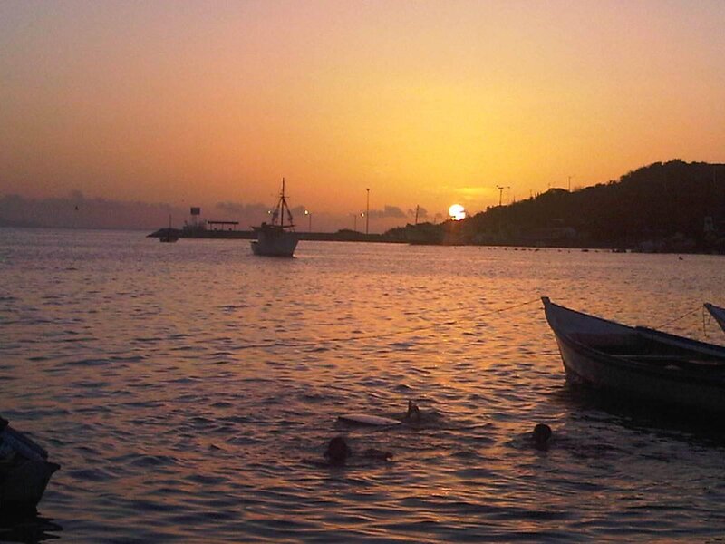People Swimming at Sunset — Orange, Serene, Photograph, Boats