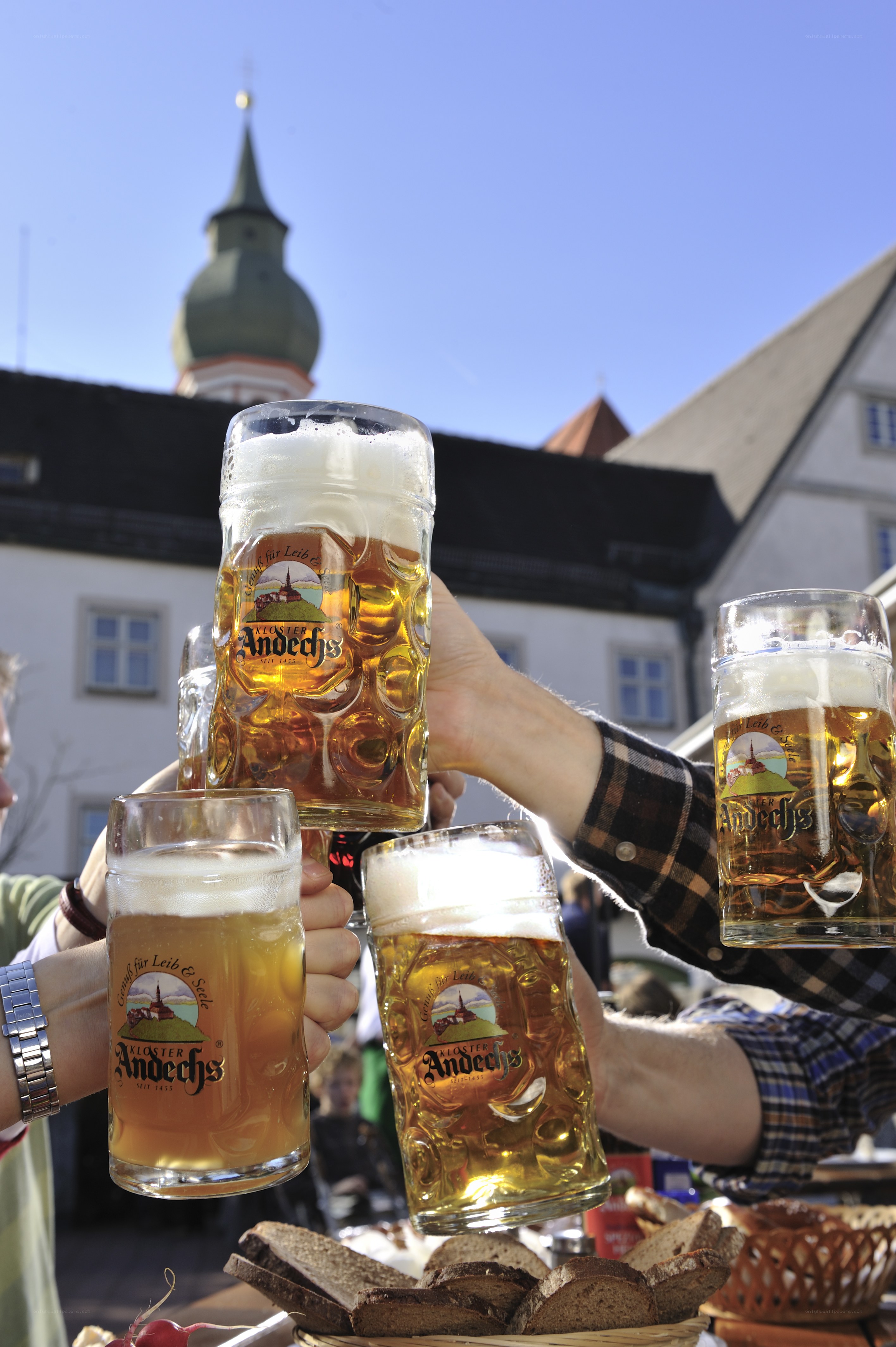 People toasting with beer mugs