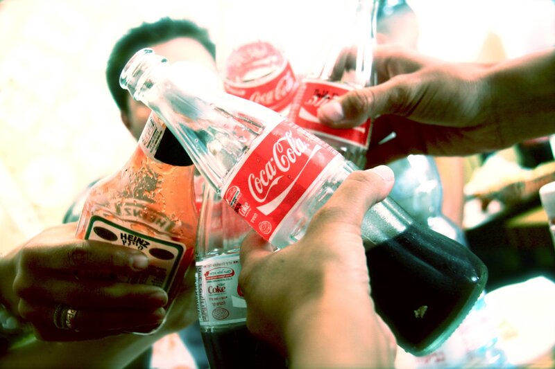 people toasting with drinks