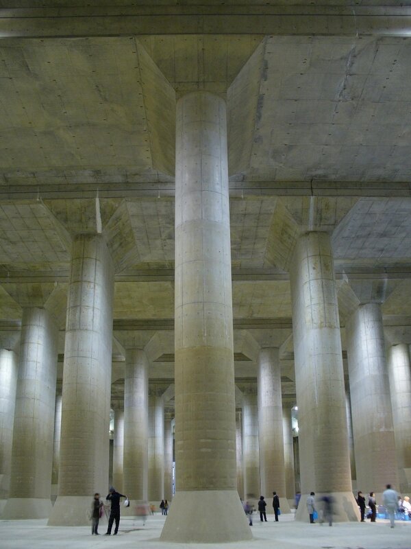 People under a concrete structure