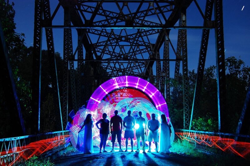 People under a light bridge