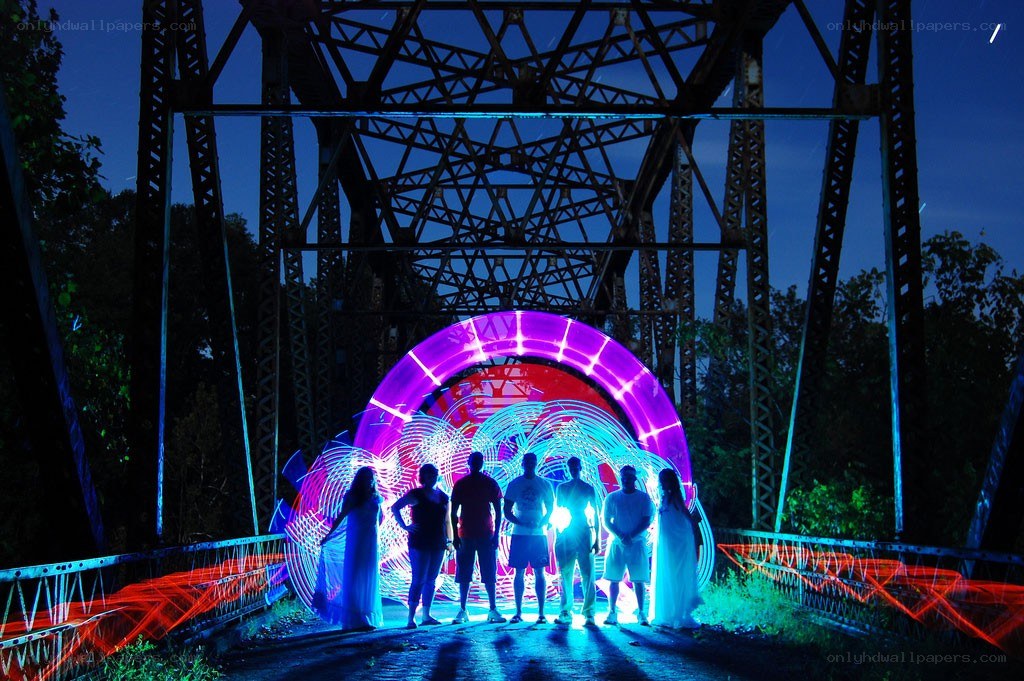 People under a light bridge