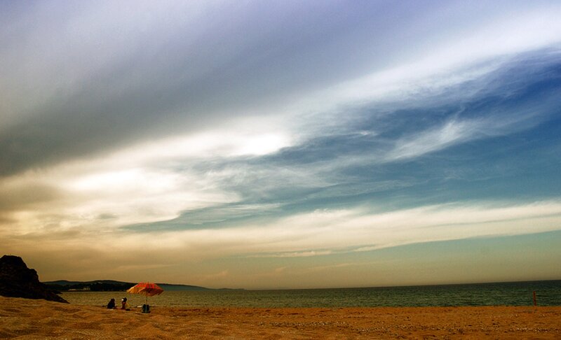 People under Umbrella on Beach