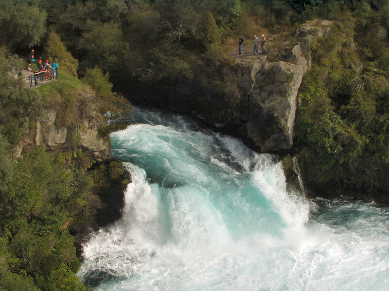 People viewing a river rapids