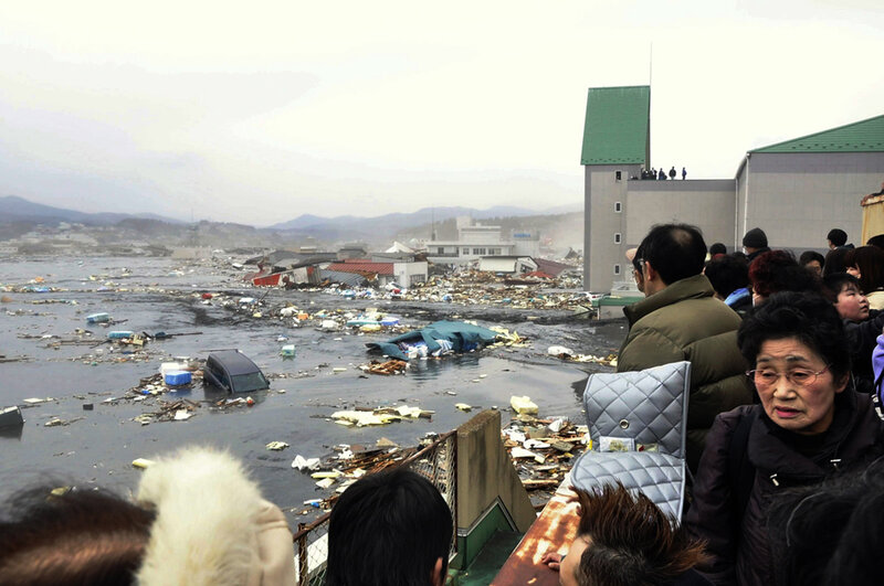 People Viewing Disaster Site