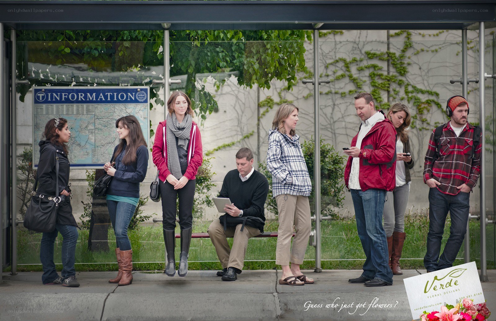 People waiting at a bus stop