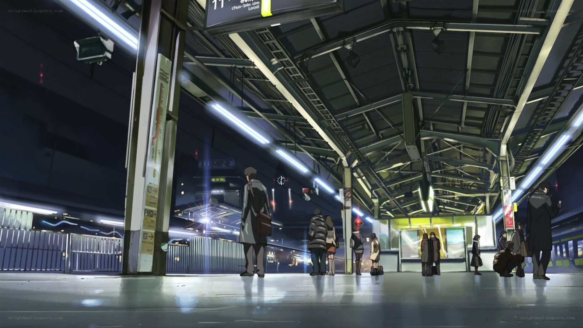 People waiting at a train station