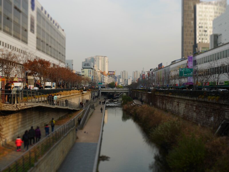 People Walking Along River