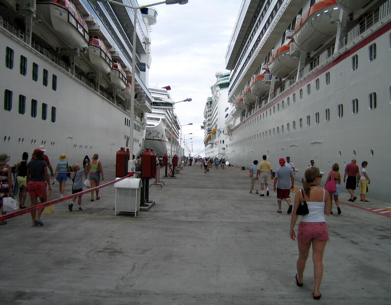 People Walking Between Cruise Ships