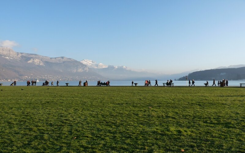 People Walking by Lake