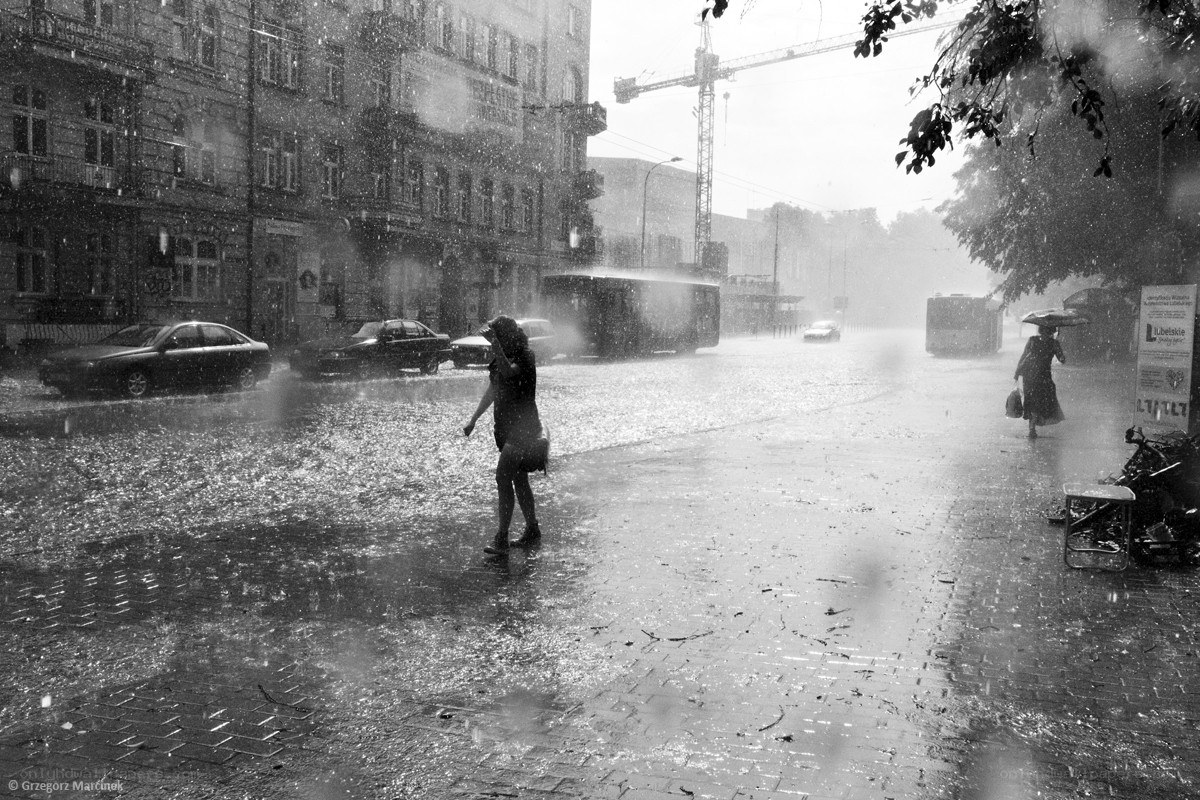People walking in a rainstorm
