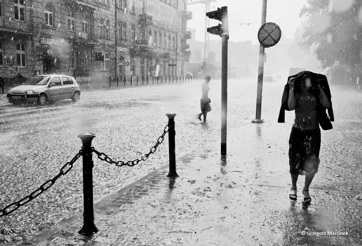 People walking in a rainstorm