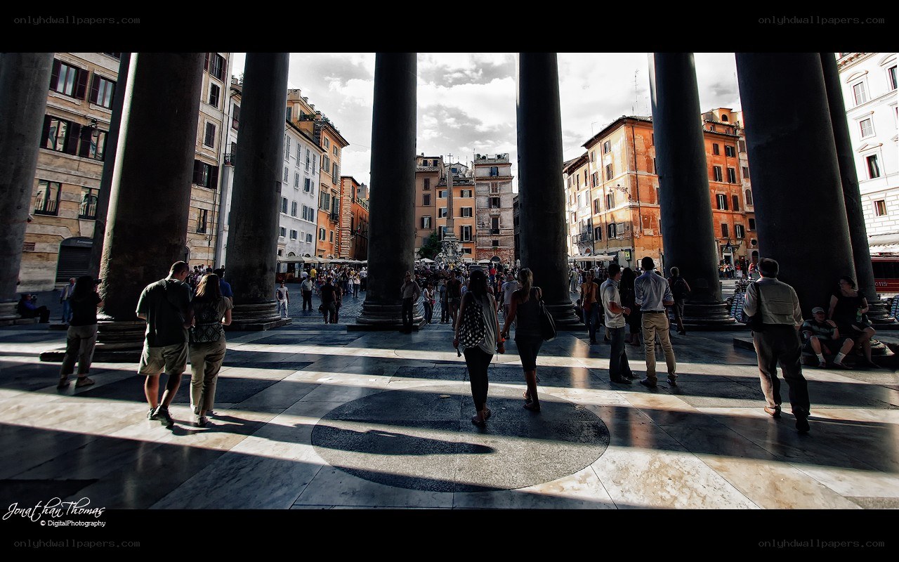 People walking in a Roman square