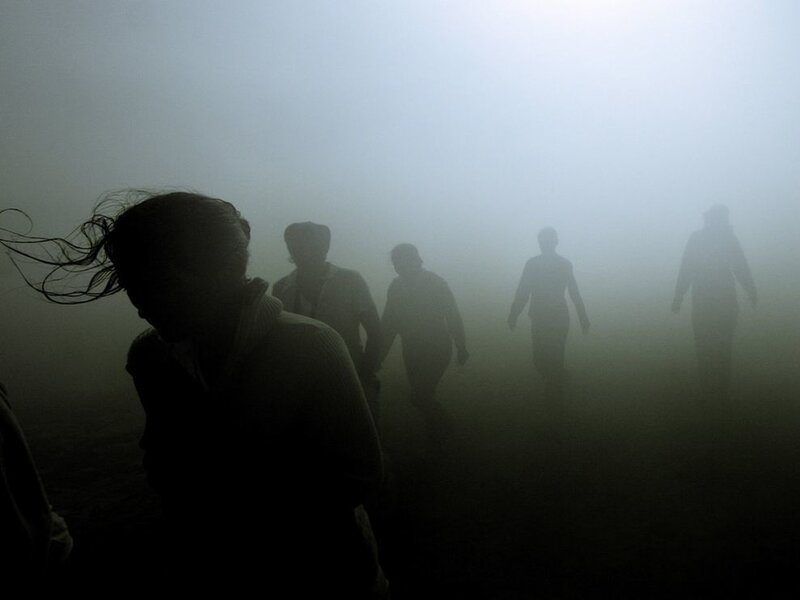 People walking in fog