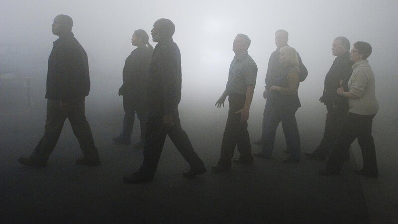 People walking in fog