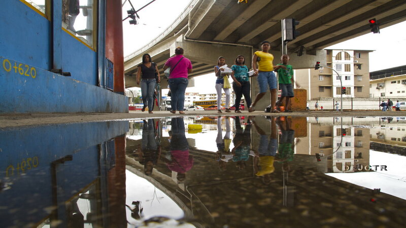 People Walking in Puddle