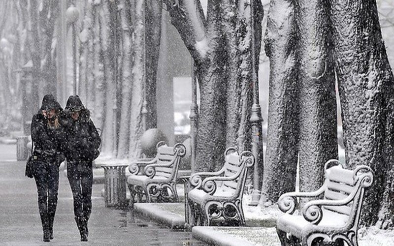 People walking in snowstorm