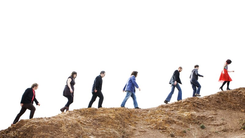 people walking on a hill
