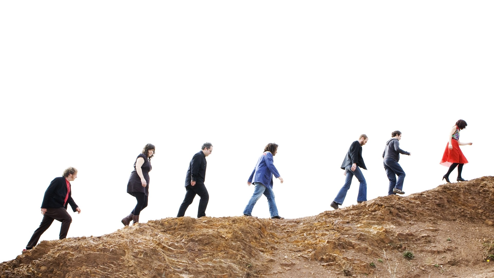people walking on a hill