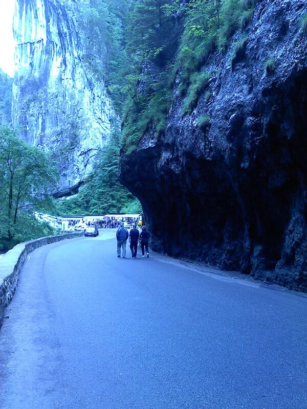 People walking on a road in a canyon