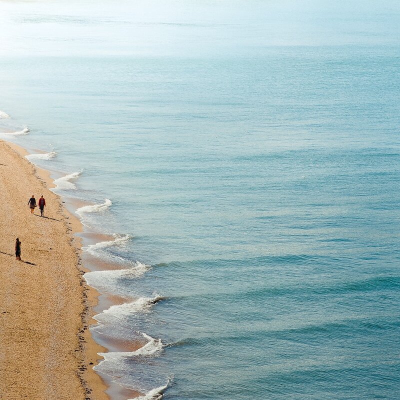 People walking on a sandy beach