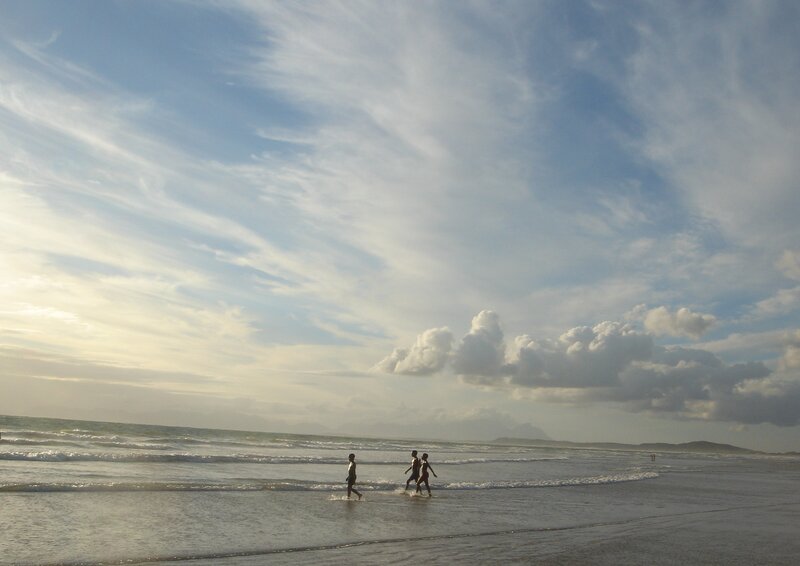 People Walking on Beach — Blue, Serene