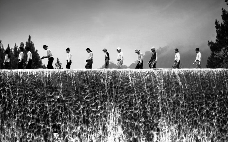 People Walking on Dam