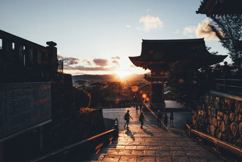People Walking on Stone Steps