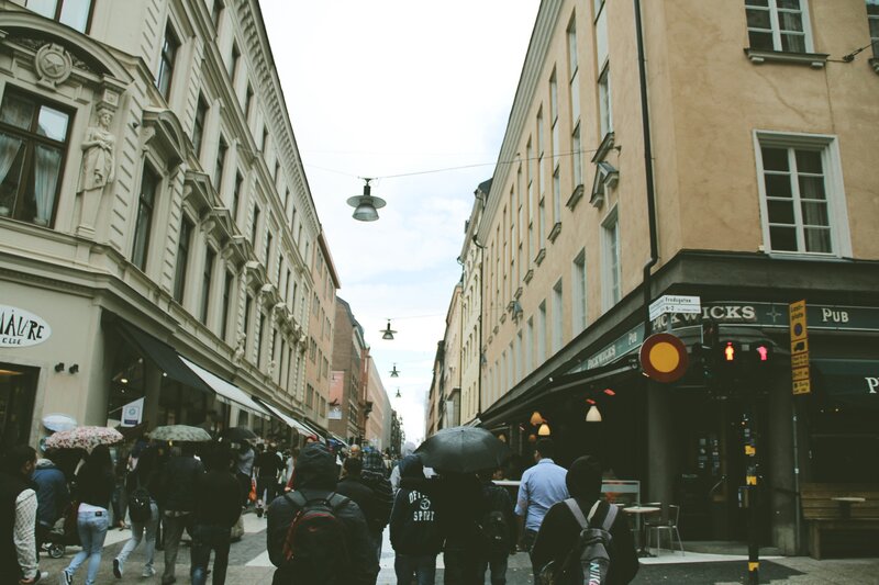 People Walking on Street — Gray, Overcast