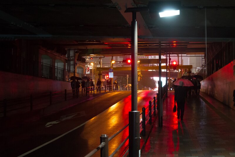 People Walking under Bridge
