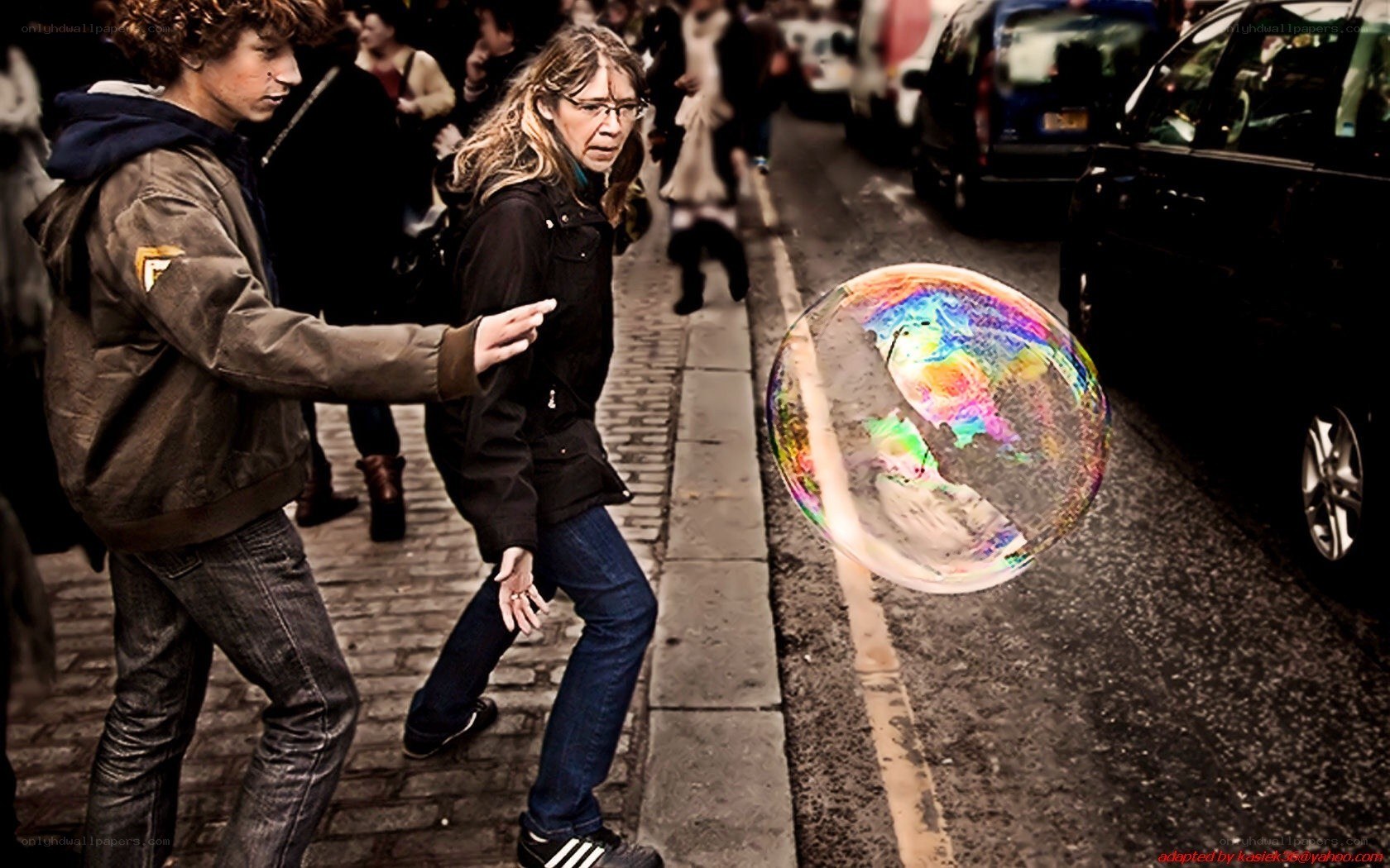 People walking with a large soap bubble