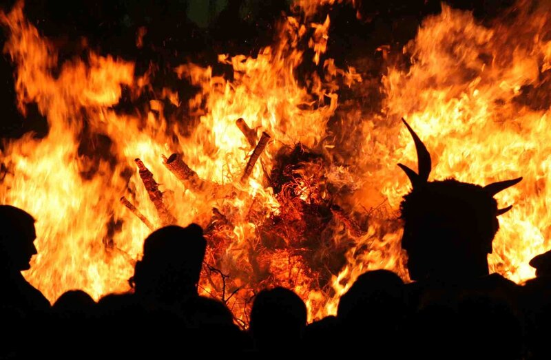 People watching a bonfire