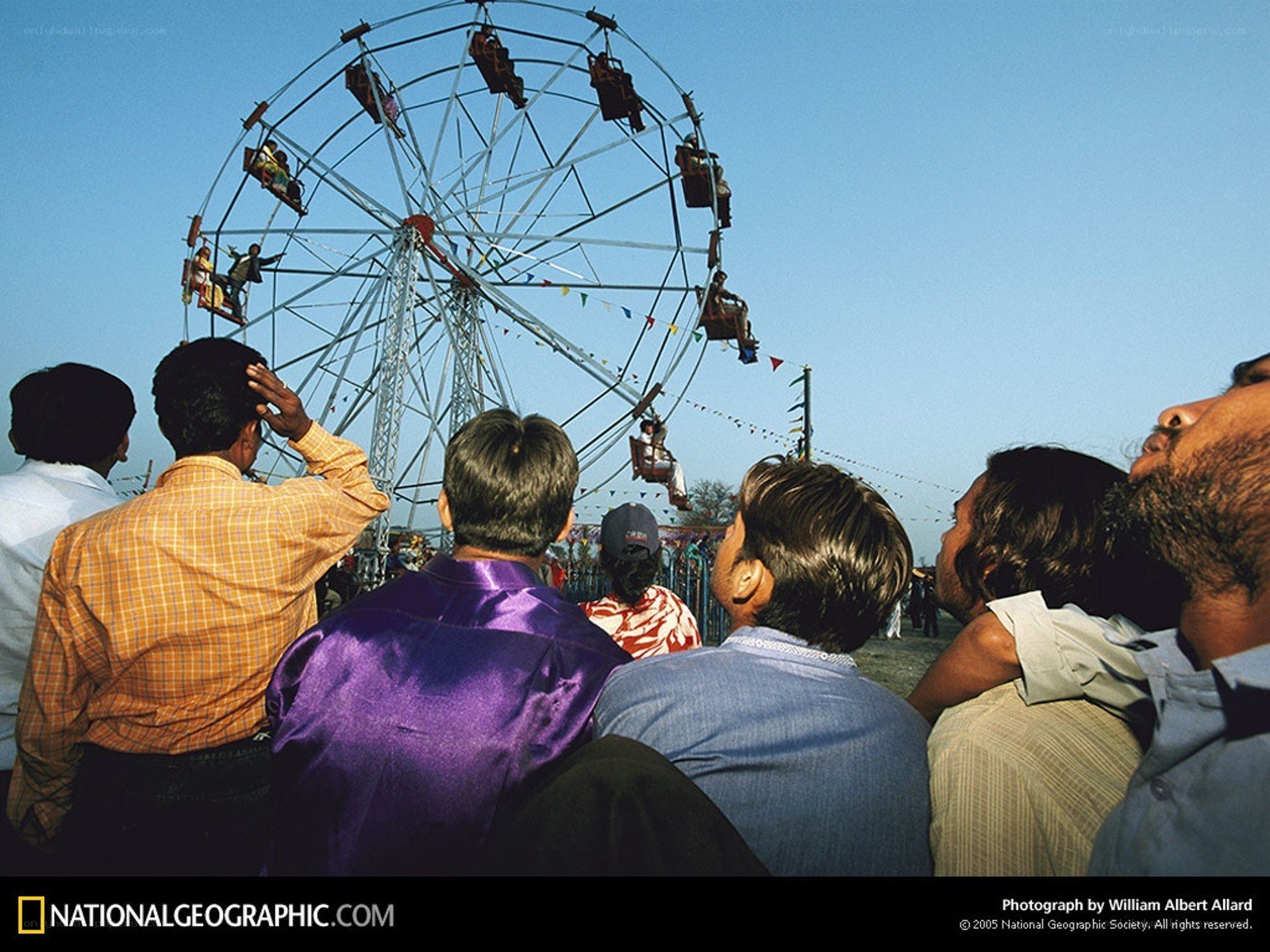 People watching a Ferris wheel