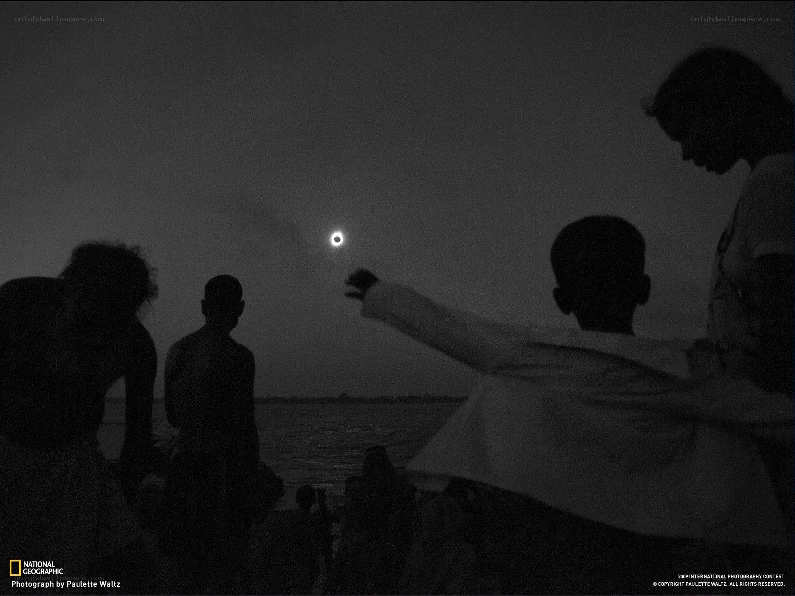 People watching a solar eclipse