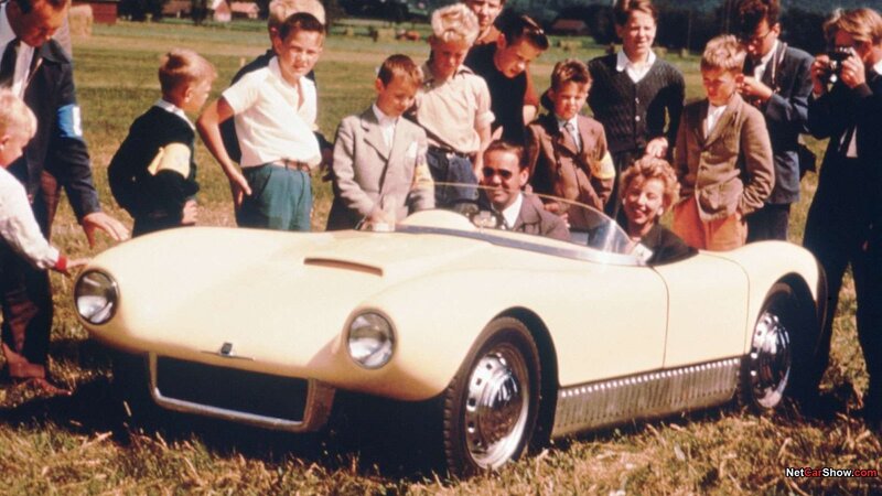 People with a vintage car