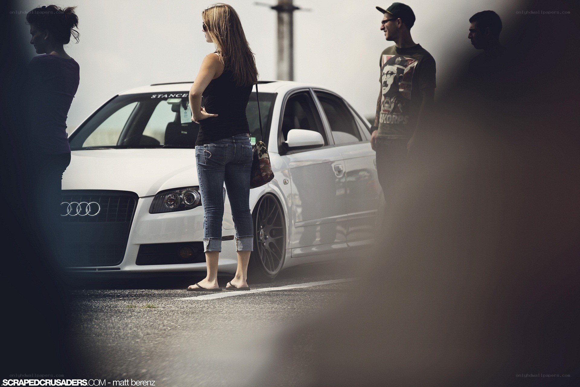 People with a white Audi car