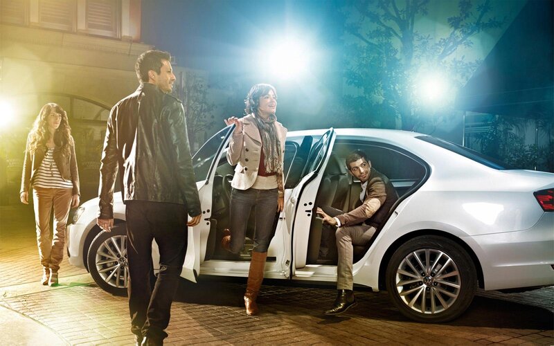 People with a white car at night