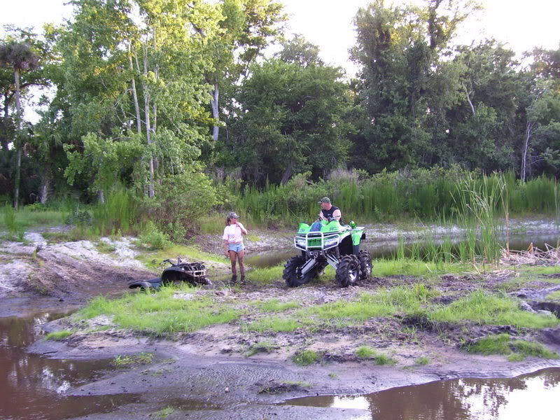 People with ATVs in Swamp