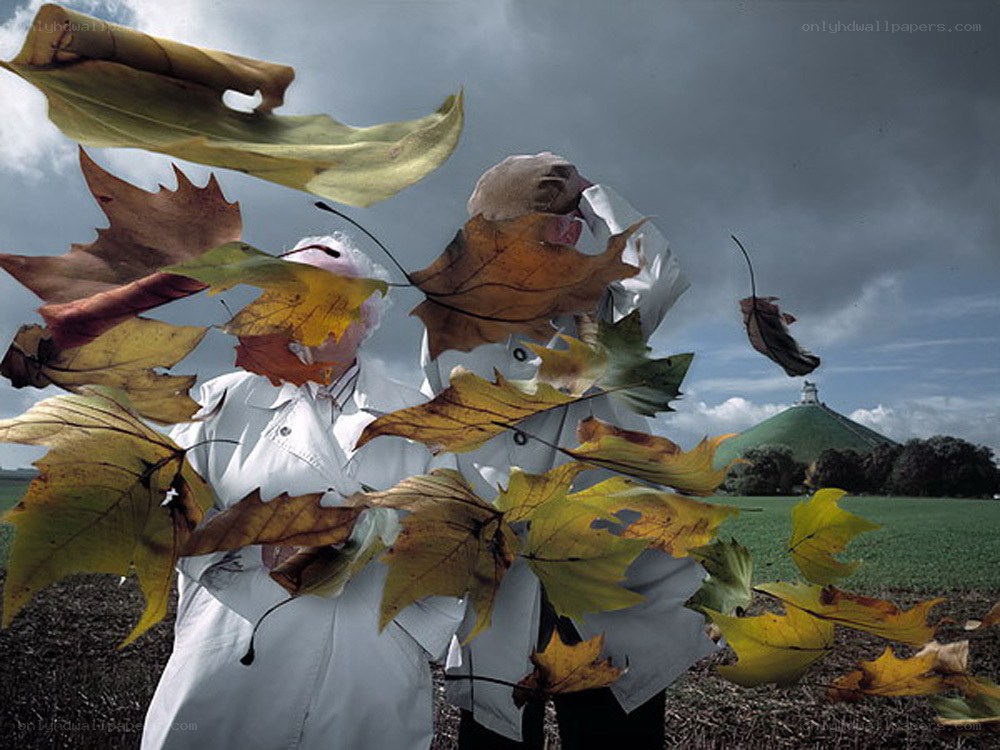 People with autumn leaves