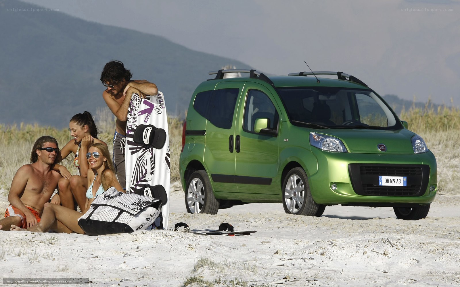 People with car on beach