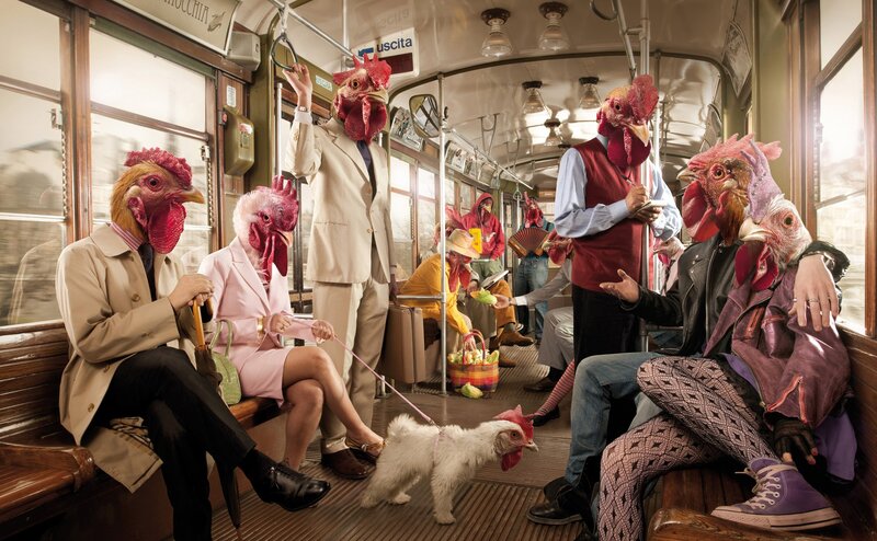 People with chicken heads on a tram