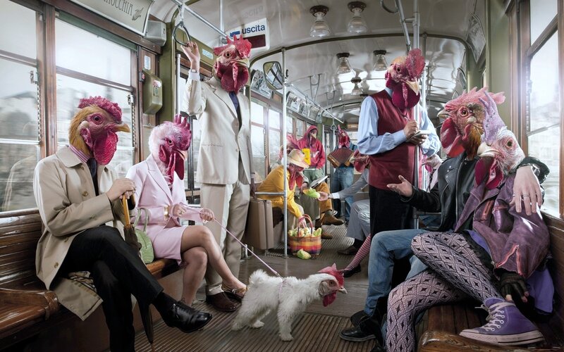 People with chicken heads on a tram