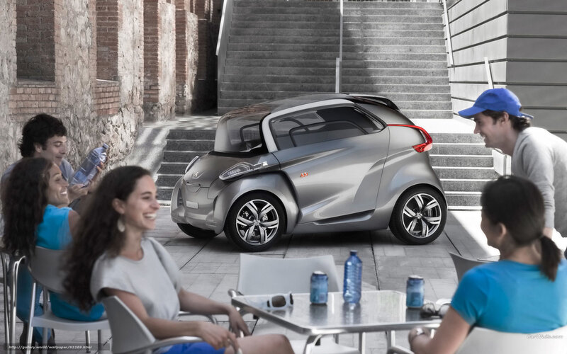 People with concept car in city
