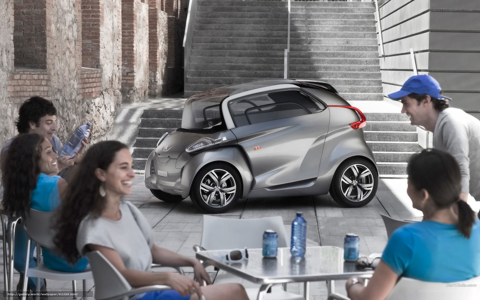 People with concept car in city