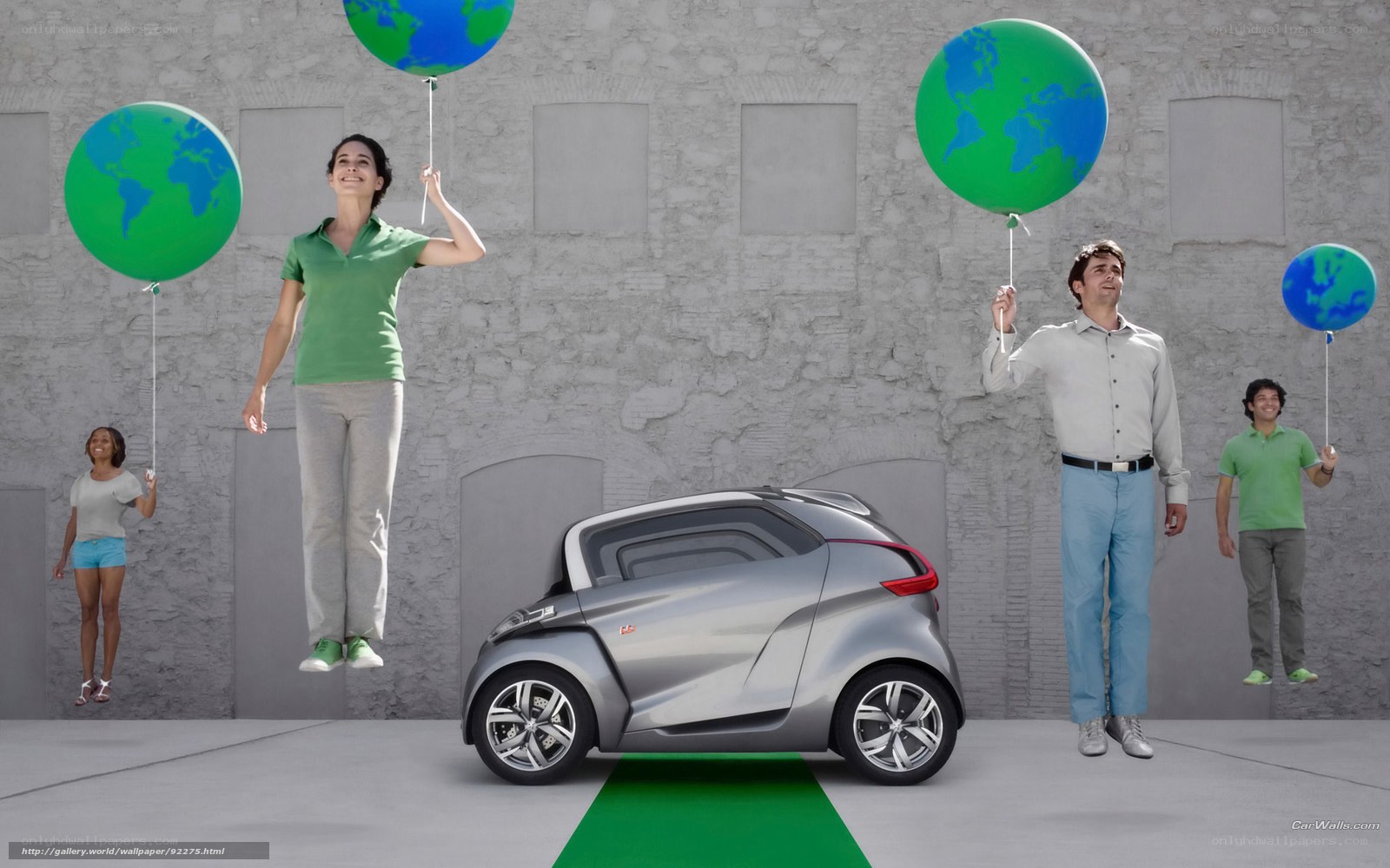 People with Earth balloons and car