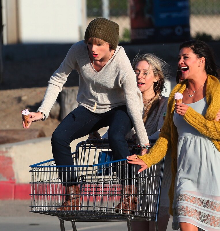 People with ice cream in shopping cart