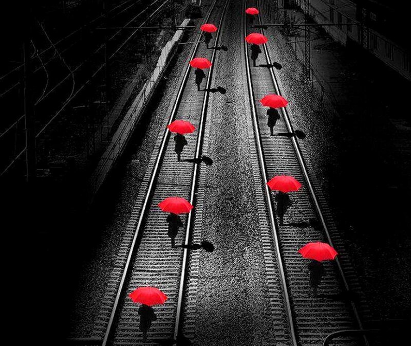 People with Red Umbrellas — Dramatic