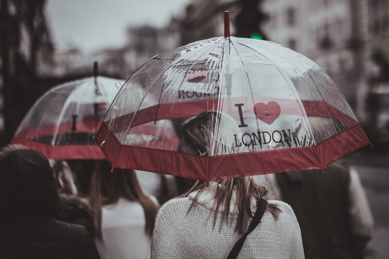 People with umbrellas in London